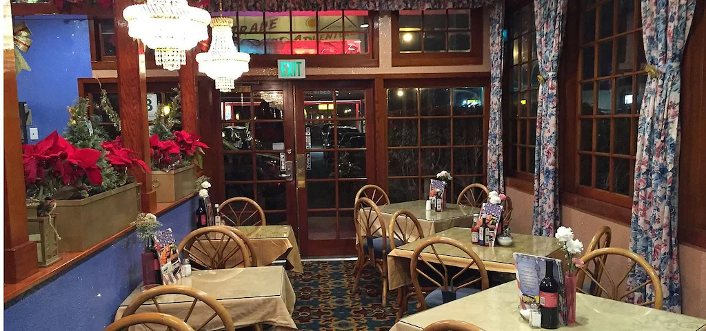 Dining room with vintage decor and Christmas decorations.